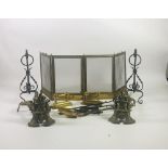 A pair of fine quality "Adams" style brass Fire Dogs, a Spark Guard,