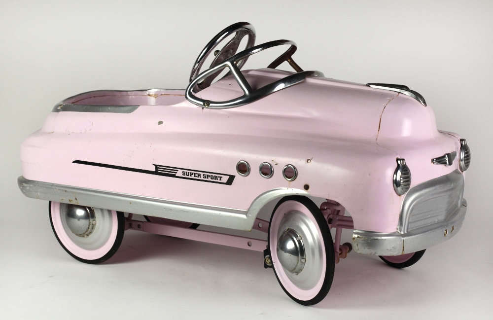 A pink Comet Sedan Supersport Girl's peddle Chair.