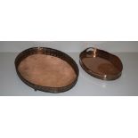 A large oval shaped silver plated copper Tray, with pierced and decorated rim on four scroll feet,