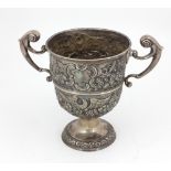 An 18th Century Irish silver two handled Cup, with repoussé decoration depicting eagles, fruit,