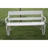 A shaped metal three seater Garden Bench, with wooden latted seats and back, painted white, approx.