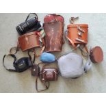 A collection of various Items, including binoculars, old cameras, and other trinkets, (as a lot).