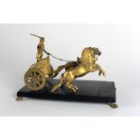 A good quality 19th Century heavy gilded bronze Figure of a Roman Charioteer,