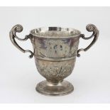 A large 18th Century Irish silver two handled Cup, with floral, shell and fruit repoussé decoration,