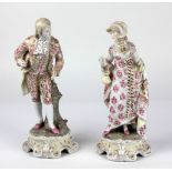 A pair of attractive porcelain Figures, "Lady & Gent," with pink floral clothing. (2) approx.