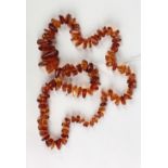 An attractive amber stone Necklace, approx. 76cms (30"l) approx. 90 stones.