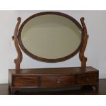 A 19th Century inlaid mahogany Dressing Table Mirror, of bowed outline,with three frieze drawers.