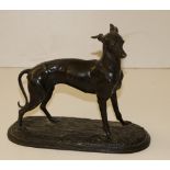 A 19th Century metal, pewter? Model of a Whippet, 9cms (7 1/2") high.