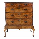 A fine quality 19th Century walnut Chest, of two short and three long drawers on stand,