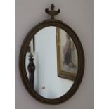 An Adams style oval gilt Wall Mirror, with urn finial, approx. 69cms (27") h.