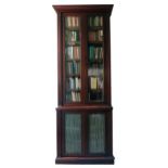 A very tall 19th Century mahogany two door Bookcase, with moulded cornice,
