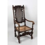 A late 18th Century carved walnut Armchair, with Bergére back and seat, in the Cromwellian style.