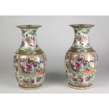 A fine pair of late 19th Century Cantonese Vases, with painted and gilt panels of figures,