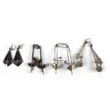 Four pairs of varied designed silver Ear-rings, inspired by the space-age race.