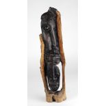 Ethnographical: An unusual carved wooden Relief, possibly African (Congolese) with elongated noses,