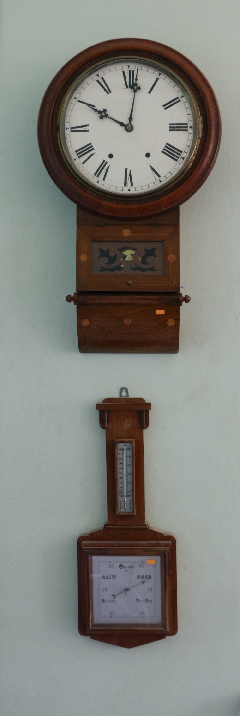 An Edwardian inlaid circular Wall Clock, with Roman numerals; together with a square dial barometer.