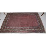 A 19th Century cream ground and multiple geometric woolen Rug, with blue ground slim border, approx.