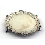 A small London silver Card Tray, with shell decorated border on three pad feet, 6 1/2" (16cms) wide,