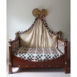 A fine quality Regency period Empire style Canopy Day Bed, with giltwood winged surmounts,