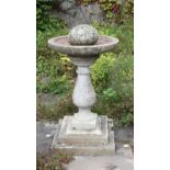 An attractive composition circular Bird Bath, on stepped square base,