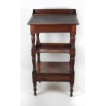 An early 19th Century mahogany Porters Desk, with lift up top on turned supports and legs.