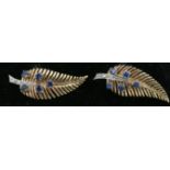 A pair of 9ct gold feather shaped Ear Rings, with sapphires and small diamonds.