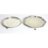 An Edwardian silver plated circular Tray, with shaped rim, engraved body,