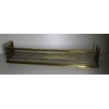 A large Regency period pierced brass Fender, 125cms x 24cms (49" x 9 1/2").