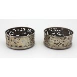 A good pair of attractive Irish 19th Century silver pierced and decorated Wine Coasters,