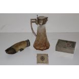 A cutglass and silver mounted Claret Jug; a silver Ashtray;