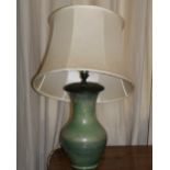 A green ground baluster shaped Moorcroft Table Lamp, two floral design porcelain Lamps,