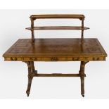 An Arts and Crafts Library Table, the rectangular walnut lime wood crossbanded and oak top,