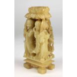 An early carved pale Celadon Jade Ornament, decorated with two figures in native attire,