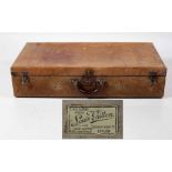 An early leather Louis Vuitton rectangular Suitcase, with stamp "L.V.
