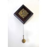 A late 18th Century wall mounted Water Clock, in square wooden case, with engraved brass dial,