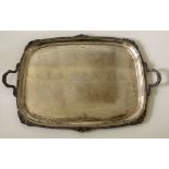 A large and heavy silver two handled Serving Tray, with scalloped edge and shell decoration,