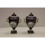 A fine quality pair of Staffordshire Royal blue ground and gilt highlighted porcelain Urns & Covers,