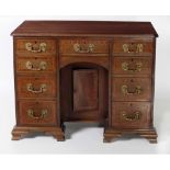 An attractive 19th Century mahogany kneehole Desk, the moulded top with inlaid border decoration,