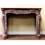 A very good 19th Century French variegated marble Fireplace, of rococo design with serpentine top,