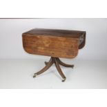 A 19th Century Irish mahogany drop leaf Table, of narrow proportions,