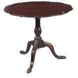 A 19th Century mahogany flip top Table, decorated in the Chippendale taste,