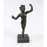An early bronze Figure, of a bearded Nude Male, with hands aloft possibly Roman, wearing headdress,