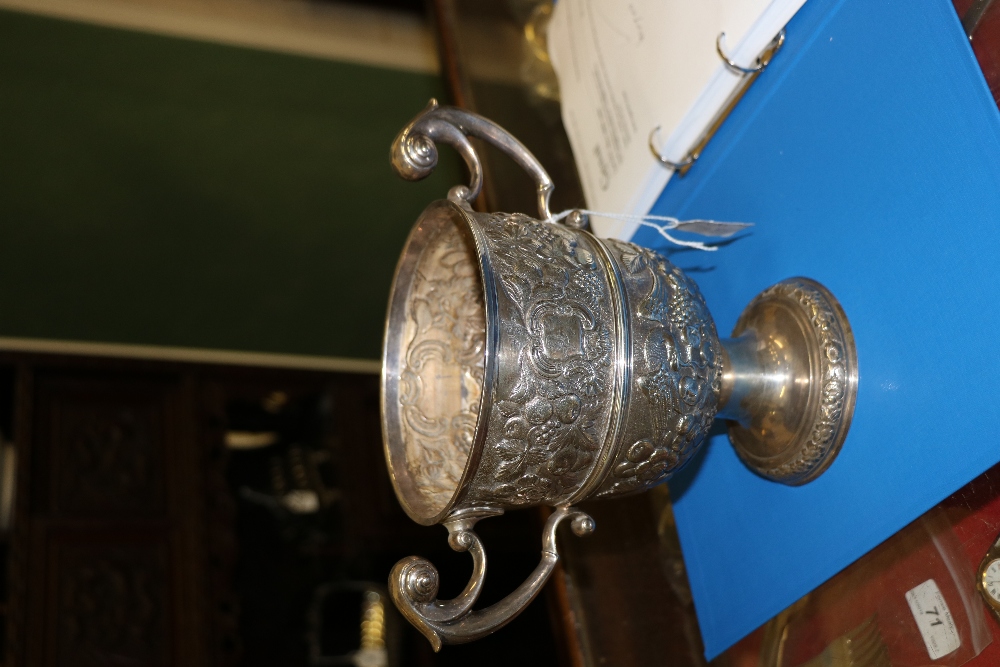 An 18th Century Irish silver two handled Cup, with repoussé decoration depicting eagles, fruit, - Image 3 of 6