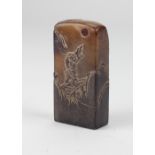 A tall Chinese carved soapstone Seal, with figure on bridge and another figure by pagodas,