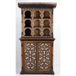 An unusual late 19th Century Arabesque Cabinet, in two parts, decorated in the Vizgapatum style,