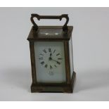 A small heavy brass cased Carriage Clock, the white enamel dial signed Dent, Pall Mall, London,
