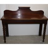 A Victorian mahogany Hall Table, of slim proportions, shaped back, on front barley twist legs,