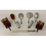 A matching set of silver Brushes & Mirrors, some in leather cases, and a long ivory Letter Opener,
