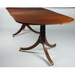 A Georgian style mahogany extending tripod Dining Table,