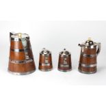 An unusual and rare suite of 4, 19th Century oak beer Jugs and Tankards, with plated bands,
